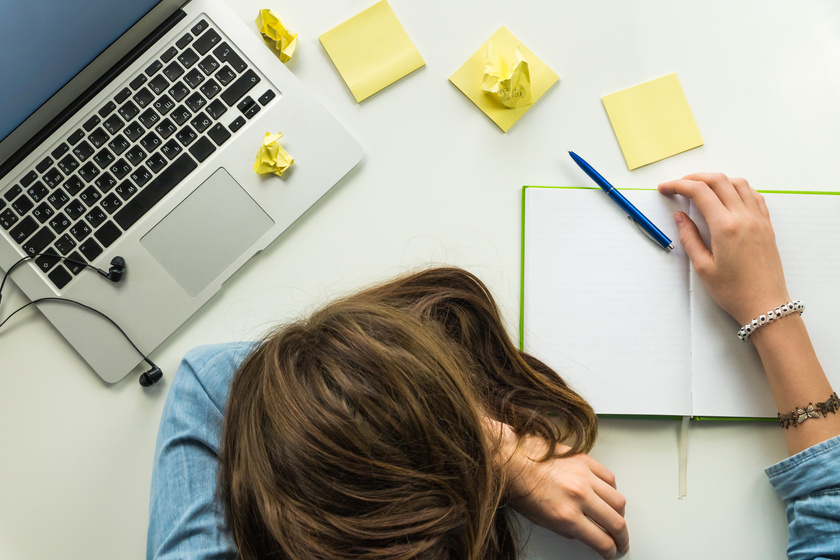 Tired Woman Resting on the Office Desk Background